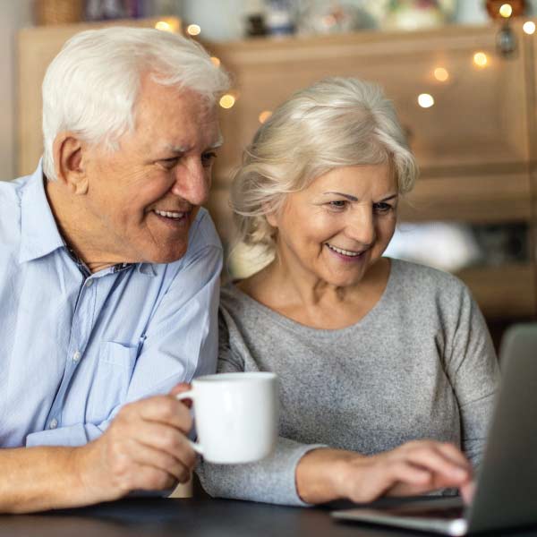 Senior Couple Looking at a Laptop